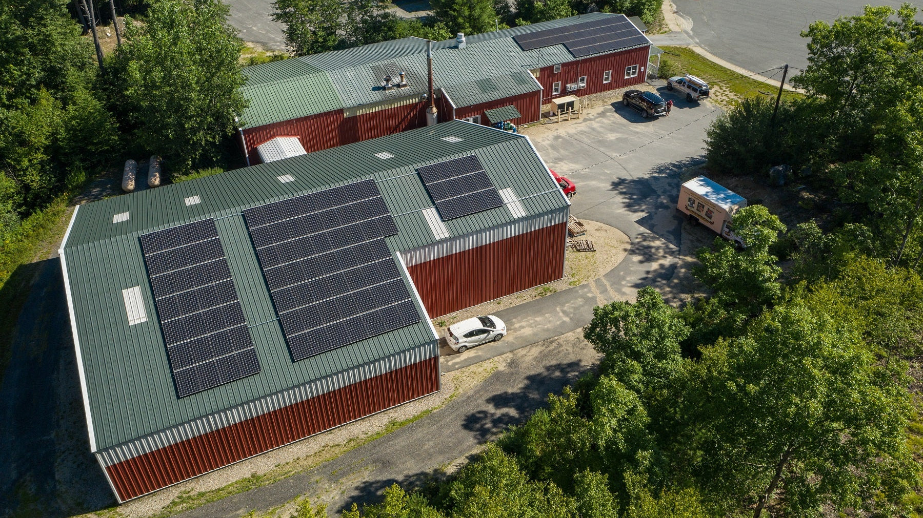 A photo of the Deans Beans warehouse with solar panels covering the roof.