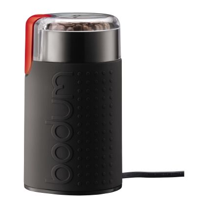 a black coffee grinder with a clear lid and red button