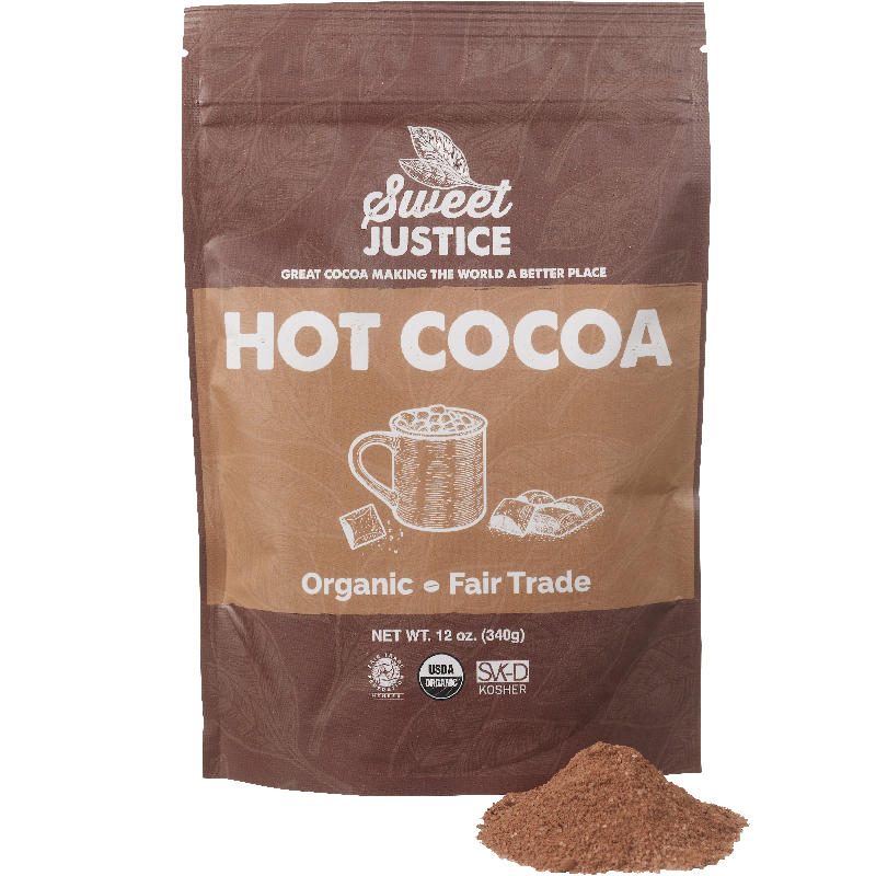 A bag of Sweet Justice Hot Cocoa with a small pile of cocoa mix in front