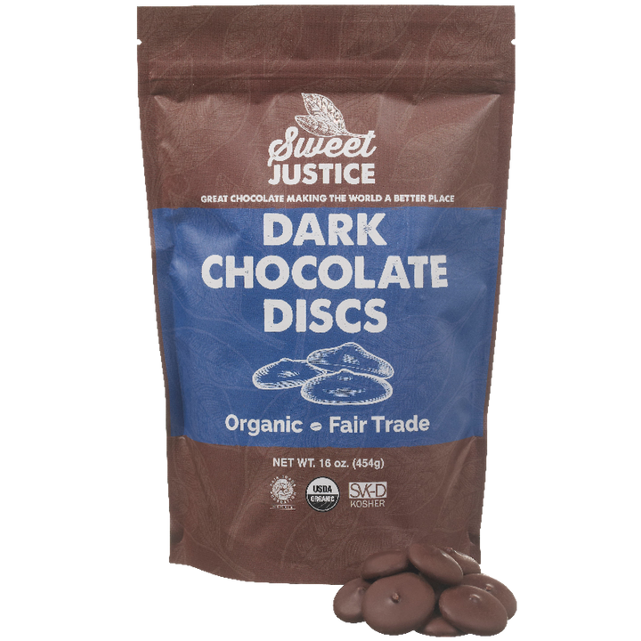 A bag of Sweet Justice Dark Chocolate Discs, with a small pile of chocolate in front