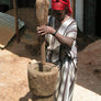 Ethiopian woman using a large mortar and pestle