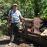 A man pulping coffee cherries