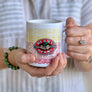 Person holding the white ceramic mug