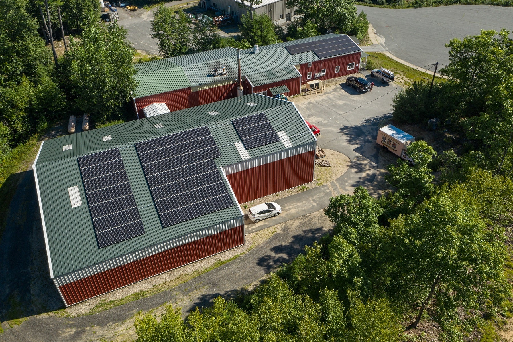 A photo of the Deans Beans warehouse with solar panels covering the roof.