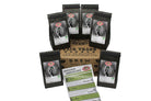 a sampler box has 6 individual bags of unroasted coffee on top of it and it displays a guide describing each coffee