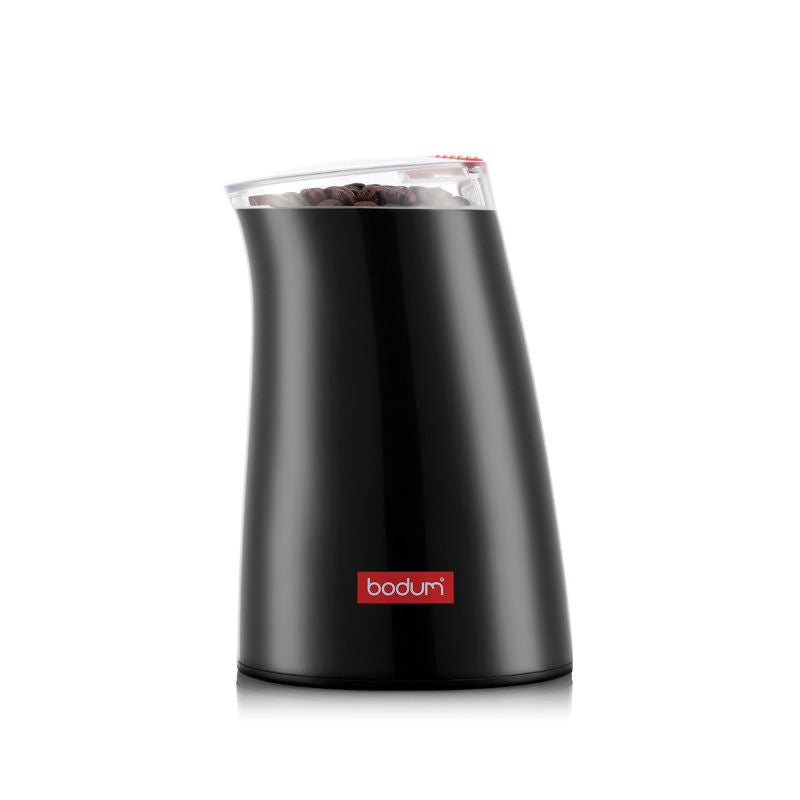 a black coffee grinder with a clear lid and red button