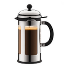 a silver colored French press with a transparent glass interior chamber