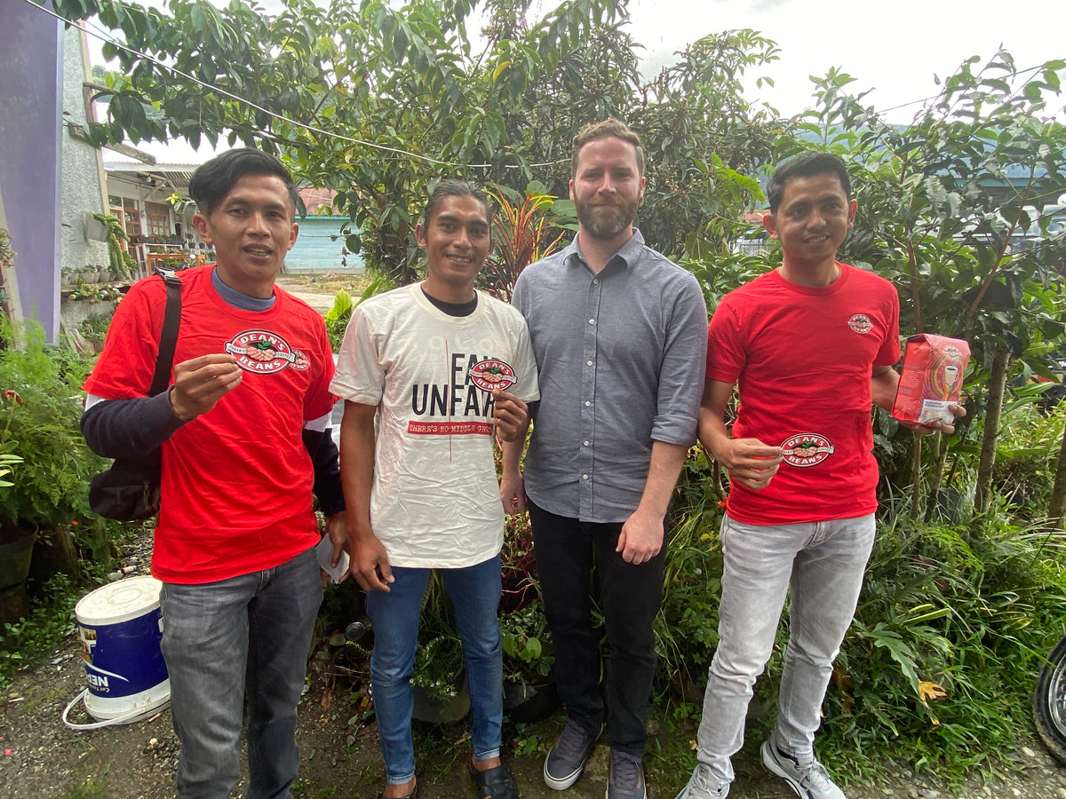 Our head roaster Brendan stands with 3 sumatran farmers
