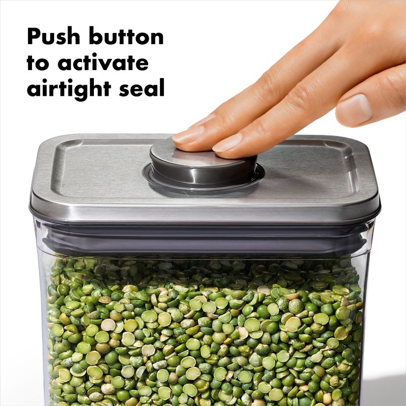 the silver lid of the canister has a button that you press to activate an airtight seal