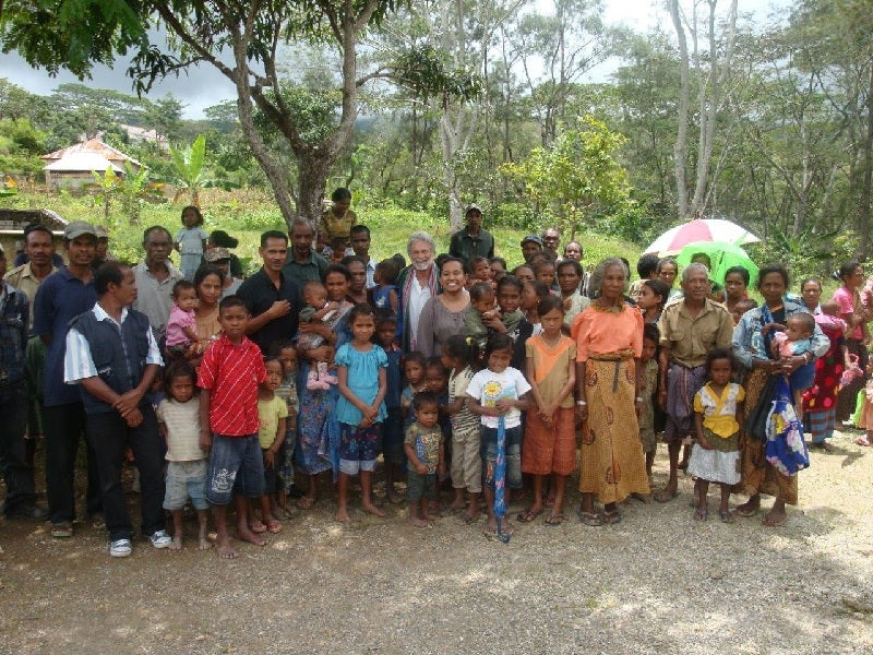 Dean with a large group of farmers and children