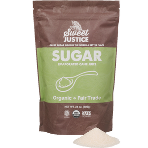 A bag of Sweet Justice Sugar, with a small pile of sugar in front