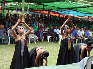 Indonesian women performing in front of a crowd