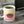 White ceramic coffee mug with colorful patterns and Dean's Beans logo