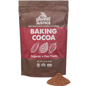 A bag of Sweet Justice Baking Cocoa, with a small pile of cocoa in front