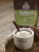 A small sugar dish filled with Sweet Justice sugar